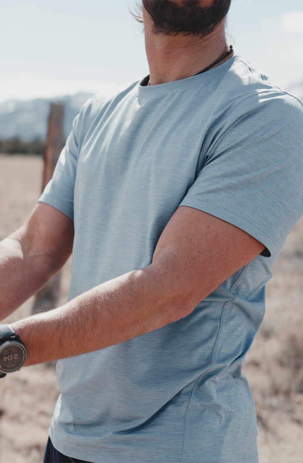 man in a light blue t-shirt